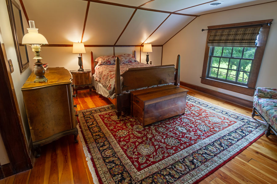 vine cottage upstairs bedroom with wood floors in natural bridge, virginia